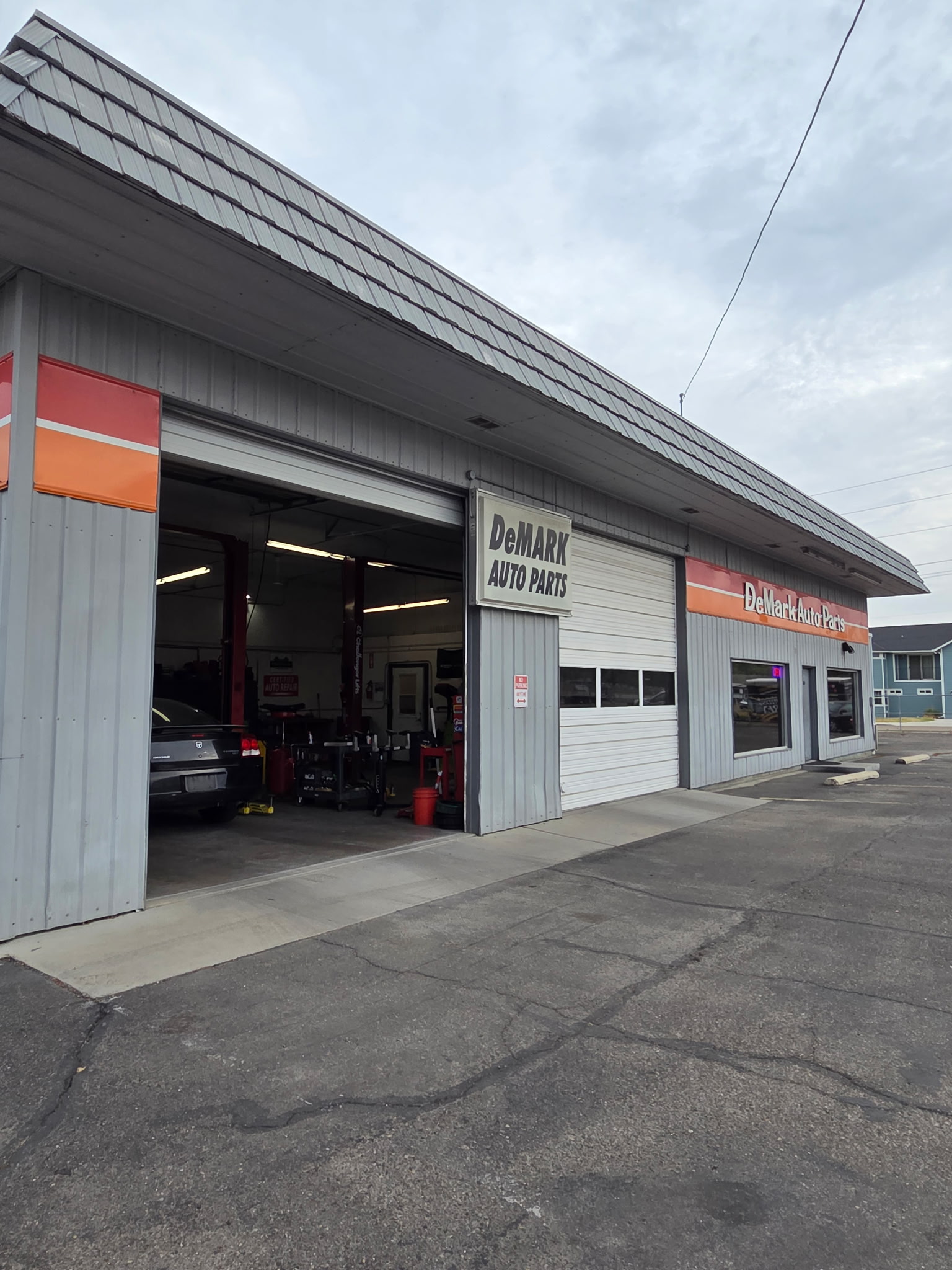 Original exterior photograph of DeMark Auto on Hannibal Street in Caldwell
